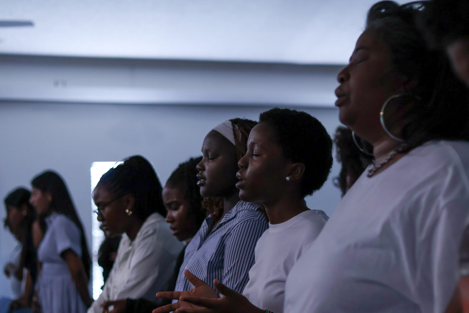 A row of worshippers at a Well Worship gathering
